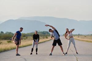 Diverse Group of Athletes Prepare Together for a Run photo