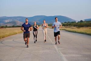 A group of friends maintains a healthy lifestyle by running outdoors on a sunny day, bonding over fitness and enjoying the energizing effects of exercise and nature photo