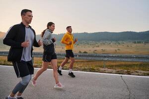 Running towards a common goal, a group of colleagues braves the misty morning air, their determination evident in every stride. photo