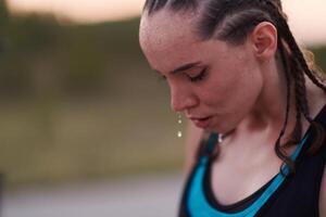 Close-Up Portrait of Determined Athlete Resting After Intense Workout photo