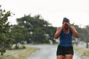 Unstoppable. A Determined Athlete Trains Through the Rain in Pursuit of Marathon Glory photo