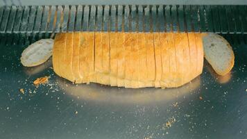 Automatic bread slicer. Slicing bread at the bakery video