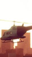 Silhouette helicopter at city scape background video