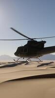 A helicopter is flying over a desert landscape video