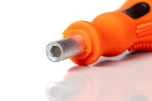 A set of different attachments for a head screwdriver with a screwdriver on a white background photo