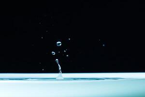 macro Beautiful drops in flight, colored drops photo