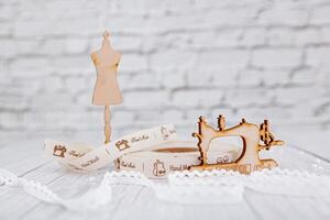 sewing tape, sewing machine and wood mannequin photo