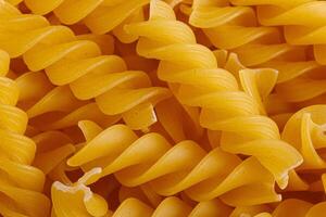 Pasta products in the form of a spiral, texture photo