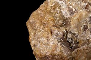 Macro of a stone Moonstone mineral on a black background photo