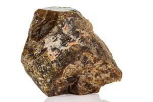 Macro of a mineral stone Vesuvianite on a white background photo