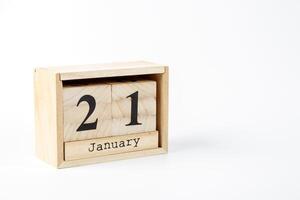 Wooden calendar January 21 on a white background photo