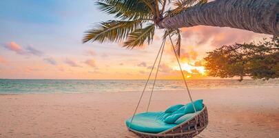 Tropical sunset beach background as summer landscape panorama with beach swing or hammock and white sand and calm sea beach banner. Perfect beach scene vacation or summer holiday concept photo