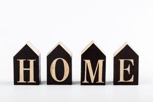 Wooden cubes with the inscription home on a white background photo