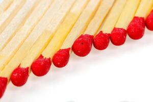 matches with a red head on a white background photo