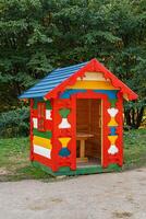 beautiful red wooden house with blue roof photo