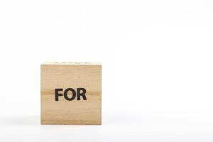 Wooden cubes with the inscription for on a white background photo