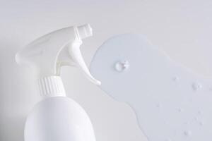 Cleaning product with a sprayer on a white background with with a sample. photo