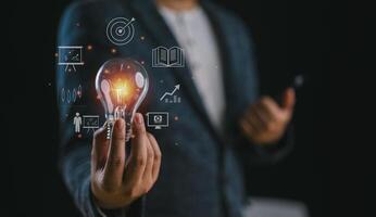 Hand holding Light bulb, Global Internet connection. Business global internet connection application technology and digital marketing, Digital link tech, big data, Financial and banking. photo