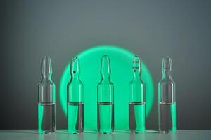 Several ampoules for injection with medicines on a green background. photo