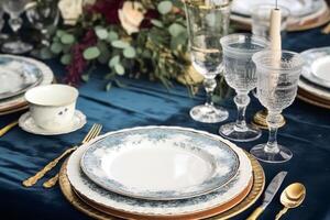 Formal holiday tablescape with blue decor, dinner table setting, table scape with elegant tableware and dinnerware for wedding party and event, photo
