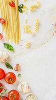 Pasta recipe preparation flatlay background with ingredients, spaghetti, olive oil, garlic, tomatoes and spices in the kitchen, homemade food recipe photo