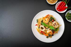 stir fried spicy noodles with sea food photo