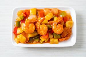 Stir-fried sweet and sour with fried shrimp photo