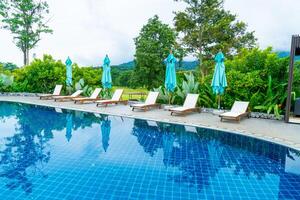 pool bed around swimming pool with mountain hill background photo