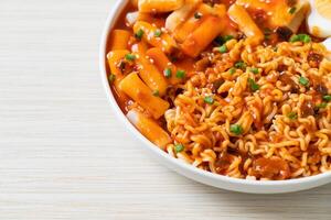 Korean instant noodles with Korean rice cake and fish cake and boiled egg photo