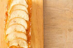 apple loaf crumbled on wood board photo