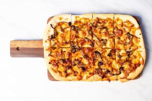 tart flambe mushroom pizza on wood board photo