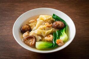 pork dumpling soup with shrimps and vegetable photo