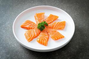 Fresh Salmon Raw Sashimi on plate photo