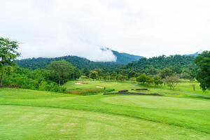 Green with Sand bunkers on Golf course photo