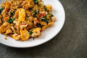 stir-fried egg with Thai basil and chilli photo