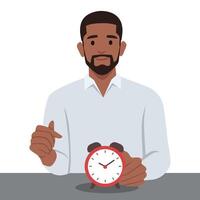 Smiling man points finger at alarm clock to remind of beginning or end of lunch break. vector