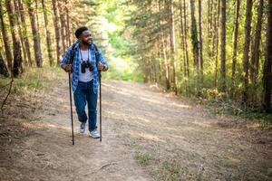 Young man enjoys hiking in nature. photo