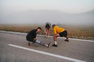 Diverse Athletes Prepare. Dynamic Group Warms Up for Morning Run. photo