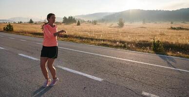 Determined Stretch. Athletic Woman Embraces Post-Run Flexibility in Nature. photo