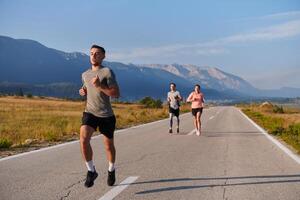 A group of friends maintains a healthy lifestyle by running outdoors on a sunny day, bonding over fitness and enjoying the energizing effects of exercise and nature photo