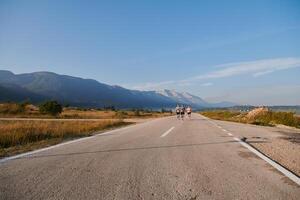 A group of friends maintains a healthy lifestyle by running outdoors on a sunny day, bonding over fitness and enjoying the energizing effects of exercise and nature photo