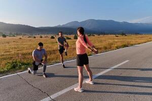 Diverse Athletes Prepare. Dynamic Group Warms Up for Morning Run. photo
