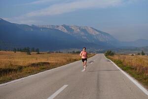 Determined Dawn. Confident and Motivated Athlete Embarks on Sunrise Run. photo