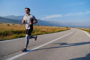 Determined Stride. Athletic Man Embarks on Marathon Preparation with Resolve. photo