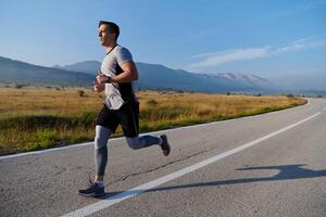 Determined Stride. Athletic Man Embarks on Marathon Preparation with Resolve. photo