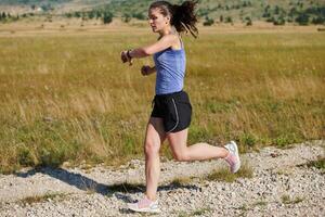 Solo Stride. Determined Athlete Woman Embarks on Fitness Journey for Marathon Preparation. photo