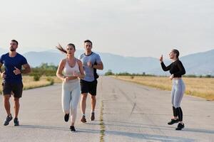 A group of friends maintains a healthy lifestyle by running outdoors on a sunny day, bonding over fitness and enjoying the energizing effects of exercise and nature photo