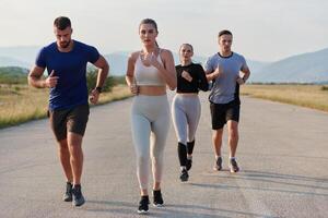 A group of friends maintains a healthy lifestyle by running outdoors on a sunny day, bonding over fitness and enjoying the energizing effects of exercise and nature photo