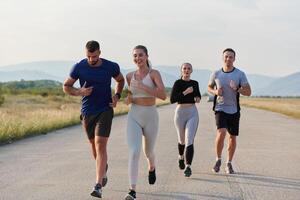 A group of friends maintains a healthy lifestyle by running outdoors on a sunny day, bonding over fitness and enjoying the energizing effects of exercise and nature photo