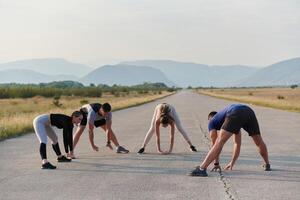 Diverse Group of Athletes Prepare Together for a Run photo